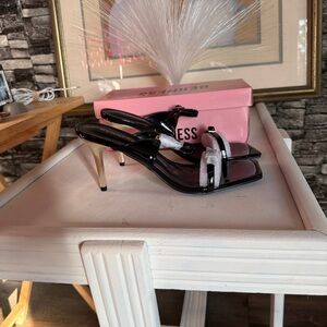 Black Patent Slingback Heels with Silver Accent